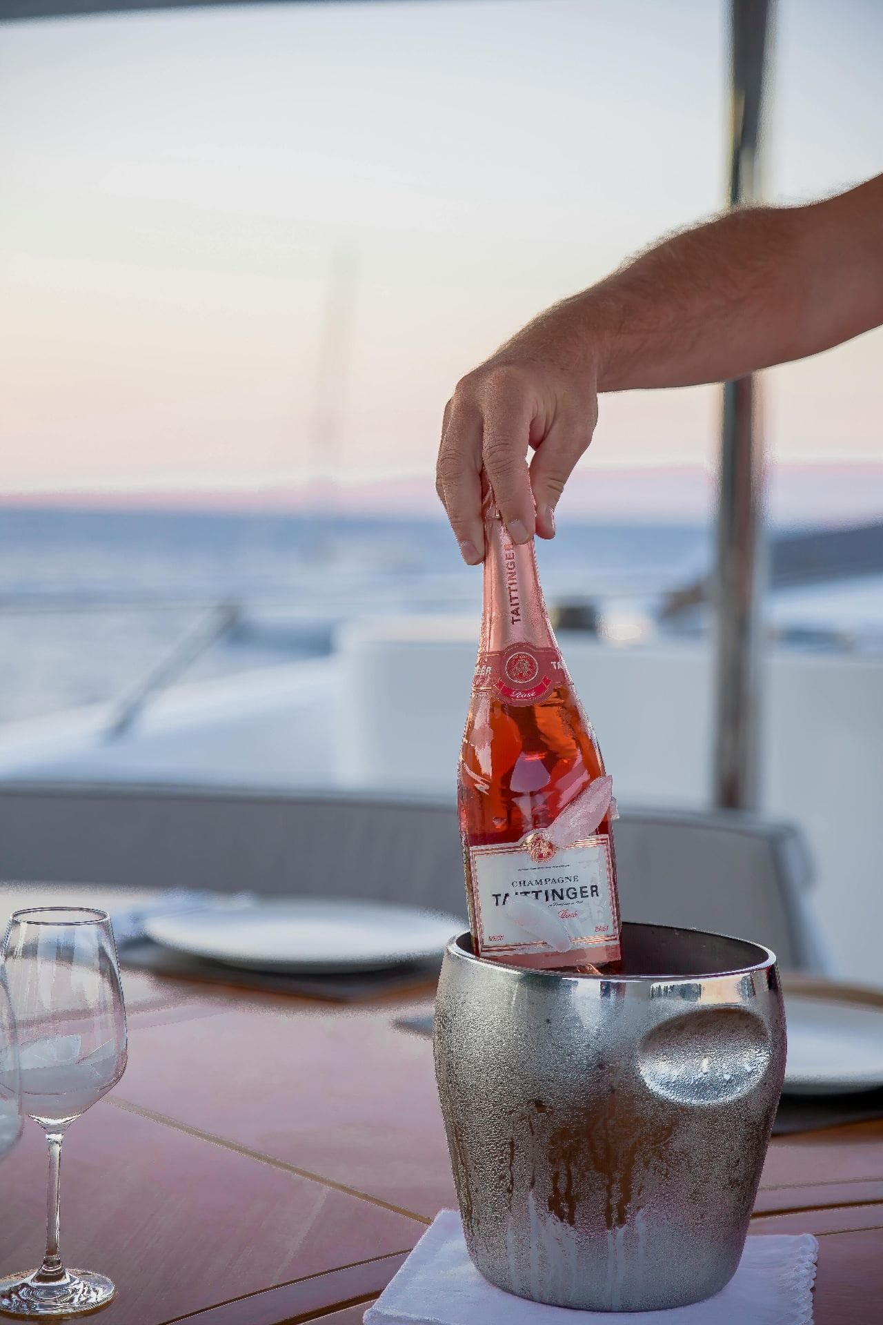 Champagne service on a yacht charter, representing the luxury charter experience