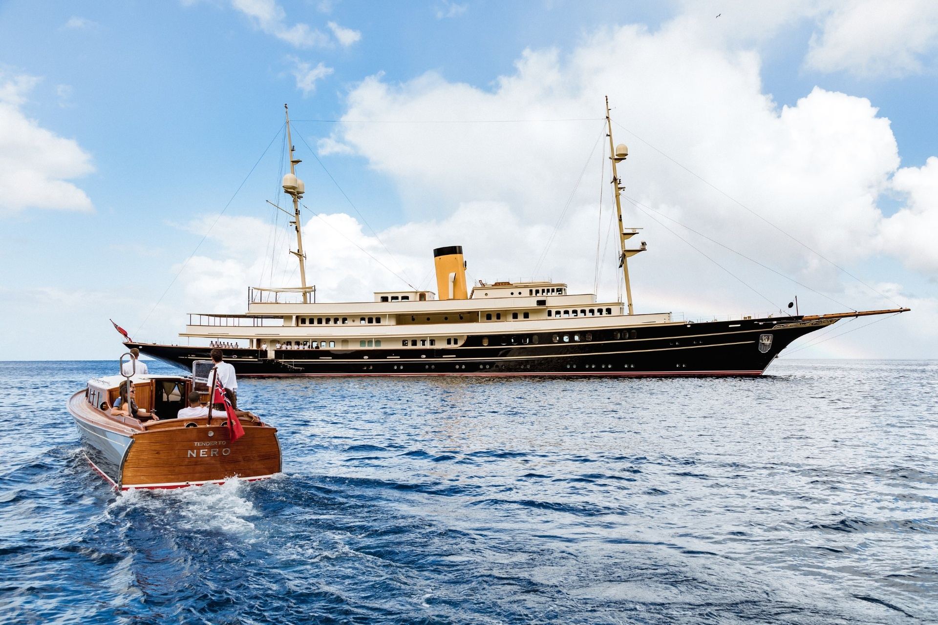 Classic luxury superyacht with wooden tender on the French Riviera