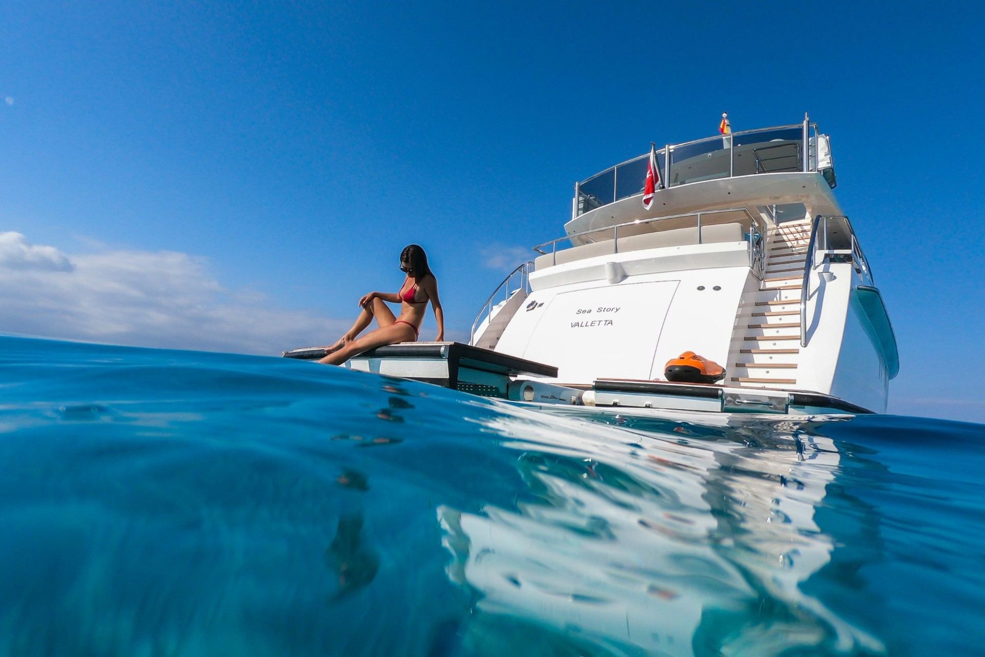 Typical Cruising Times Between Monaco, Cannes, and Saint-Tropez Vanquish 82 yacht cruising at waterline level between French Riviera ports