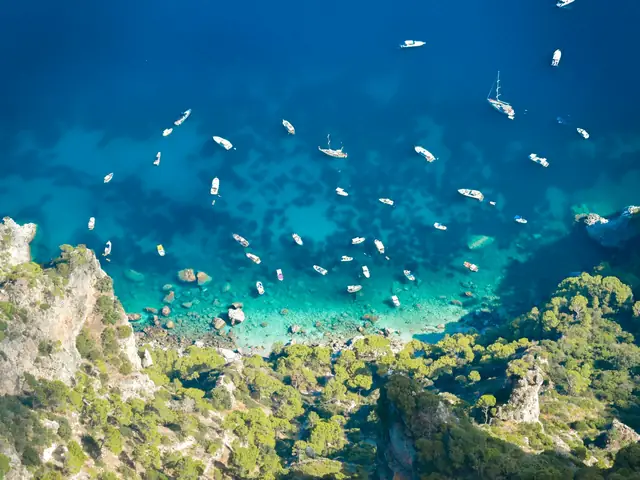 Punta Carena Lighthouse: Boats anchored in a turquoise Capri bay