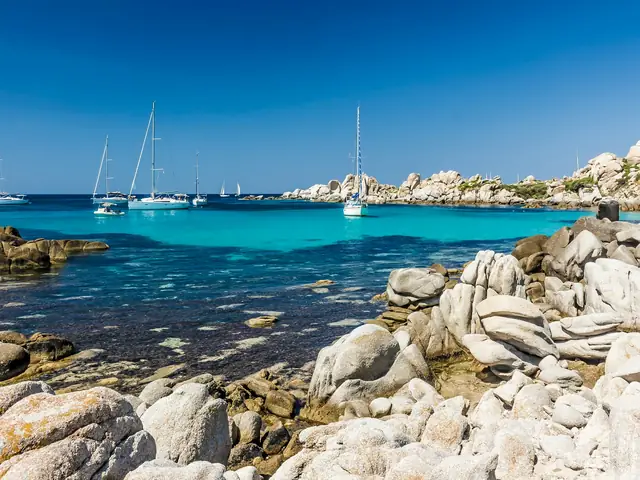 Lavezzi Islands: Granite boulders and sailing yachts in clear Corsican water