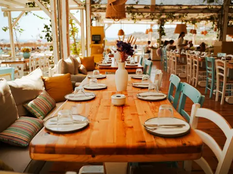 Mood photo (not the venue): Bohemian beach restaurant with tables set for lunch