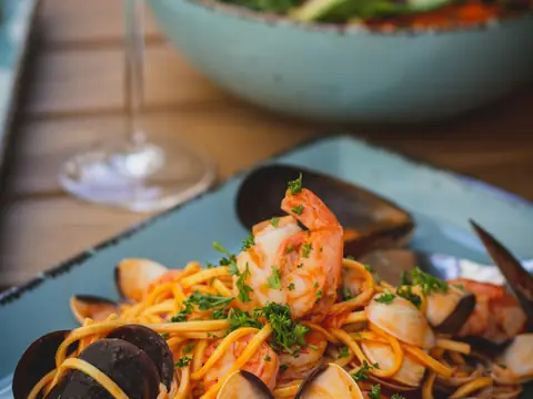 Mood photo (not the venue): Seafood pasta with shrimp and clams
